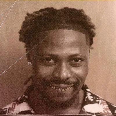 A featured image of Asake sold out concert shows Asake smiling in a mugshot